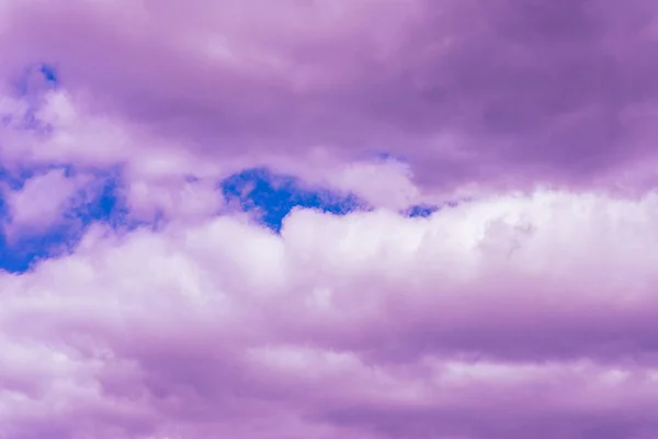 Purple clouds with beautiful blue sky,on the heaven.Amazing nature background.Toned.