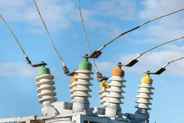 High voltage electric generator insulators.Detail of high voltage circuit breaker in a power substation.high voltage circuit breaker in a power substation on a summer day.Closeup.