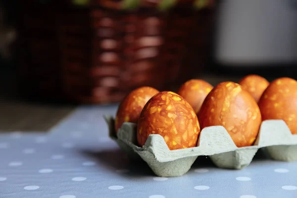 Easter eggs on a table. Easter painted eggs with marble effect. Color easter eggs painted with natural organic. Painted colorful eggs on a grey background