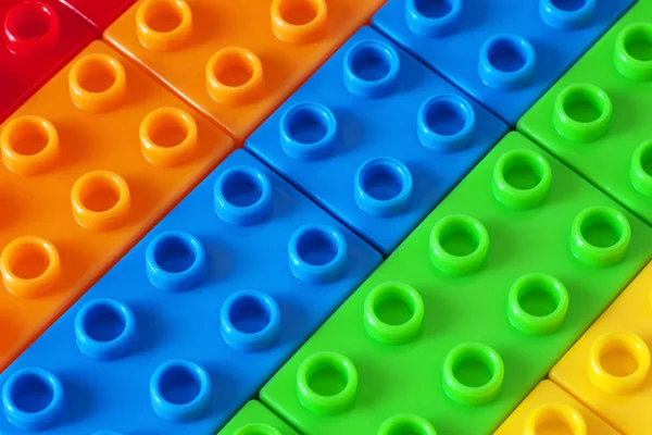 Giocattolo sfondo fatto di mattoni di plastica colorata — Foto Stock