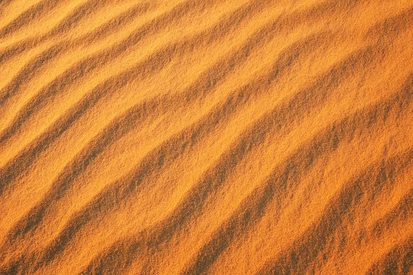 Έρημο άμμο φόντο. Χρυσές της ερήμου στο ηλιοβασίλεμα — Φωτογραφία Αρχείου