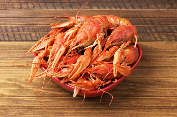 Tasty boiled fresh crayfishes on a red bowl — Stock Photo, Image