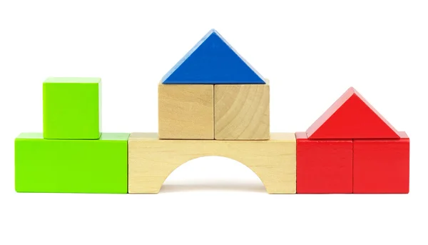 Houses made from toy wooden colorful building blocks on a white — Stock Photo, Image