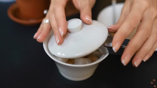 Woman takes sugar from the sugar tongs — Stock Video