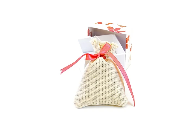 Bag with red ribbon . — Stock Photo, Image