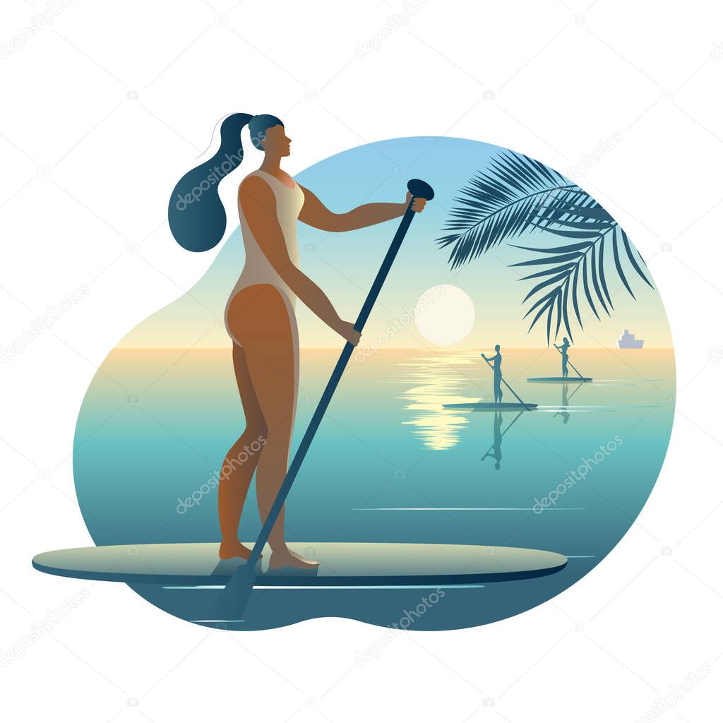A girl in a swimsuit with a paddle stands on a surfboard.