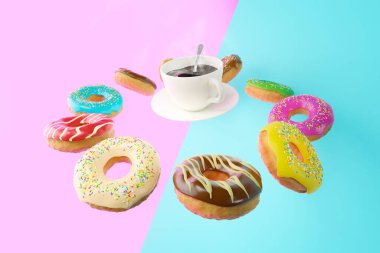 Uçan renkli çörekler ve renkli bir arka planda beyaz bir fincan kahve. Kahvaltı konsepti.