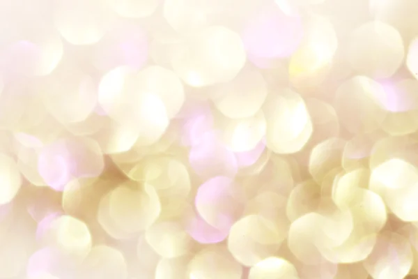 Gold and purple abstract bokeh lights, defocused background