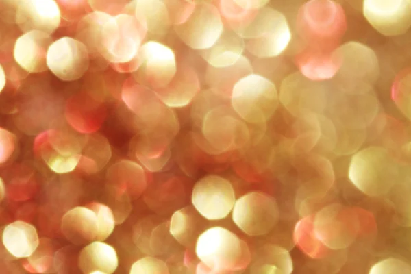 Luci bokeh astratte in oro e rosso, sfondo sfocato - colori tenui — Foto Stock