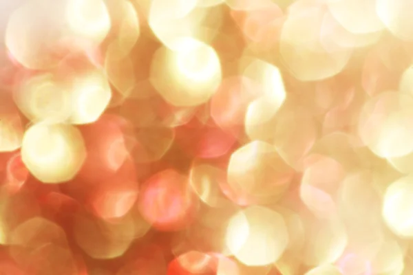 Luci bokeh astratte in oro e rosso, sfondo sfocato - colori tenui — Foto Stock