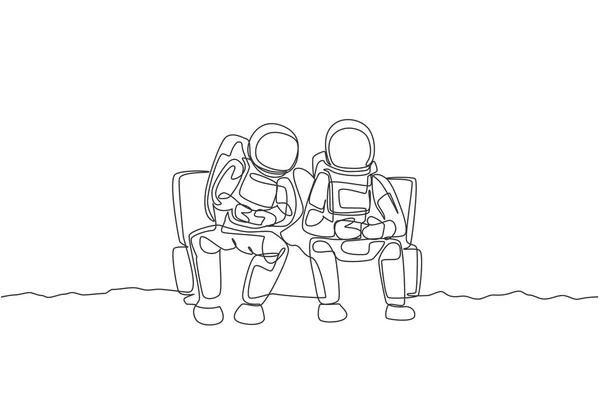 Μια Γραμμή Που Σχεδιάζει Δύο Νεαρούς Χαρούμενους Αστροναύτες Κάθονται Στον — Διανυσματικό Αρχείο