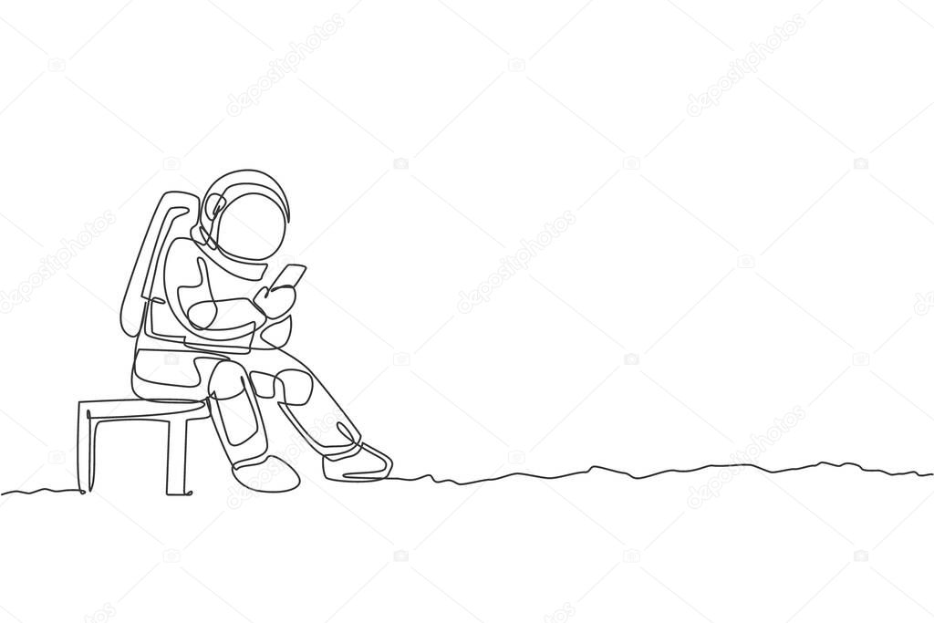 One continuous line drawing of young spaceman on spacesuit siting on chair and texting using handphone. Astronaut business office with deep space concept. Single line draw design vector illustration