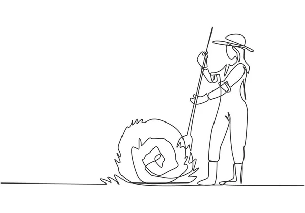 若い女性農家を描く一本の連続線は 干し草を刺し わら棒でそれを巻き上げていました 農業のミニマリズム概念 ダイナミックワンライン描画グラフィックデザインベクトルイラスト — ストックベクタ