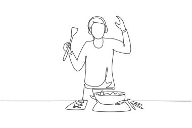 Single one line drawing young man cooking and listening to music in kitchen. Healthy food illustration. Healthy lifestyle concept. Cooking at home. Prepare food. Continuous line draw design graphic