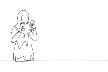Continuous one line drawing smiling Arabian woman looking at mobile phone and holding glass of orange juice while having breakfast at cozy home. Single line draw design vector graphic illustration