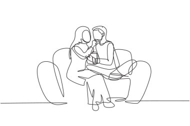 Single continuous line drawing romantic Arabian couple sitting relaxed together on sofa, woman feeding popcorn to man. Celebrate wedding anniversary. One line draw graphic design vector illustration