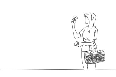 Bir kadının sürekli çizdiği bir çizgi mantar ve mantarla dolu bir sepet tutuyor. Lezzetli. Ulusal Mantar Avlama Günü. Tek çizgi çizimi tasarım vektör çizimi