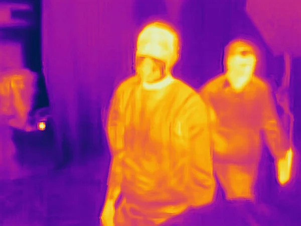 People and covid 19. Real thermal camera image.