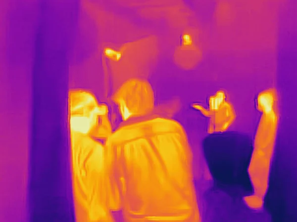 People and covid 19. Real thermal camera image.