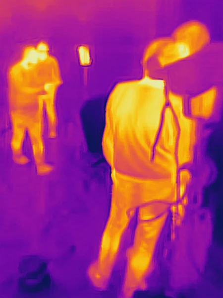 People and covid 19. Real thermal camera image.