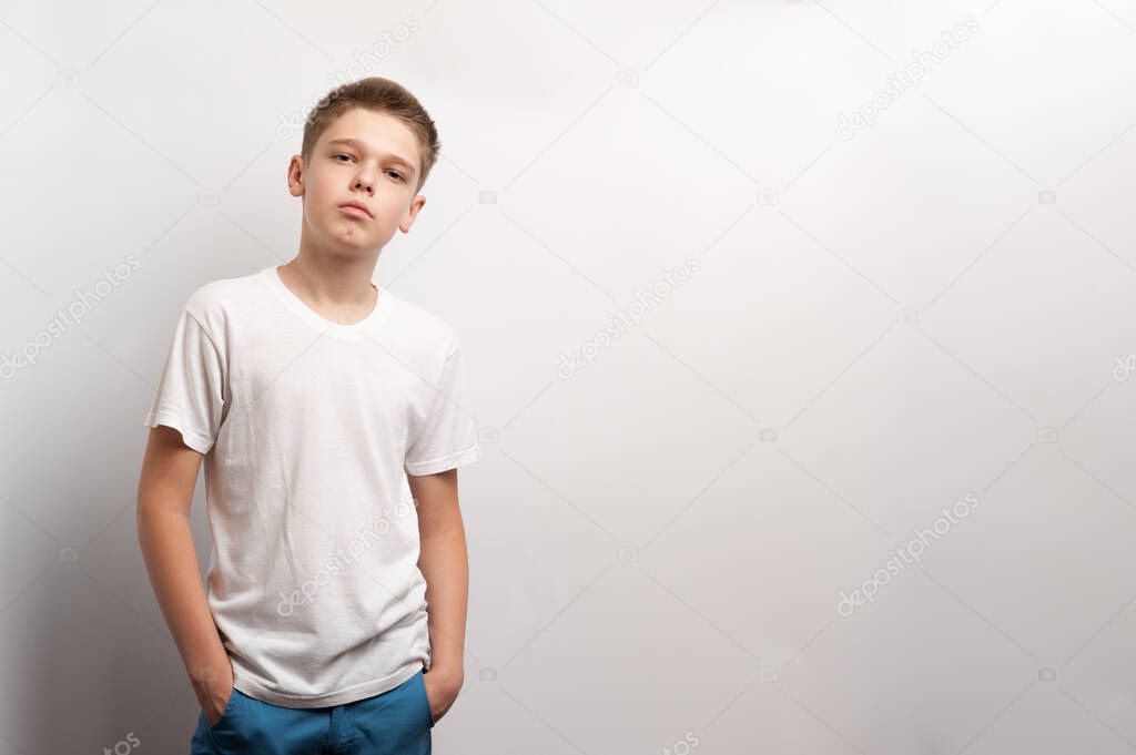 A boy model posing in a white t-shirt