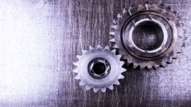 Gears'ı dönme metal bir arka plan üzerinde iş kavramı