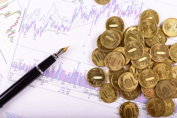 kalem ve sikkeler üzerinde arka plan grafikleri ve çizelgeleri