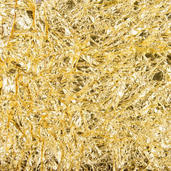 Crumpled golden foil background — Stock Photo, Image