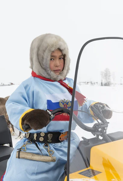 Boy on a snowmobile on a holiday "Day of reindeer herders' — Stock Photo, Image