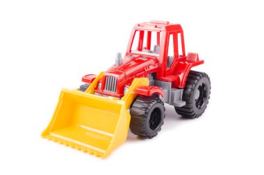 bir beyaz üzerine kırmızı oyuncak traktör 