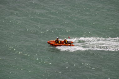 East Sussex, Beachy Head, UK 10th July 2019: The HM Coastguard Rescue Boat Team and Sussex Police attending an incident on the cliff top at the most common suicide spots in the world, Beachy Head clipart