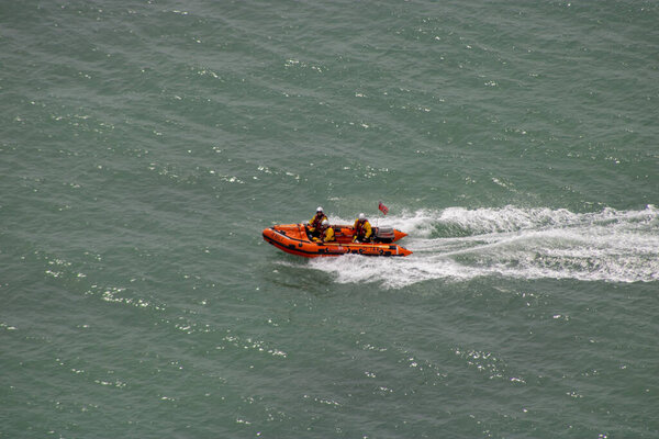 East Sussex, Beachy Head, UK 10th July 2019: The HM Coastguard Rescue Boat Team and Sussex Police attending an incident on the cliff top at the most common suicide spots in the world, Beachy Head