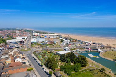 Aerial photo of the town centre of Skegness showing the pier on the sandy beach near fairground rides in the East Lindsey district of Lincolnshire, England clipart