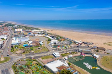 Aerial photo of the town centre of Skegness showing the pier on the sandy beach near fairground rides in the East Lindsey district of Lincolnshire, England clipart