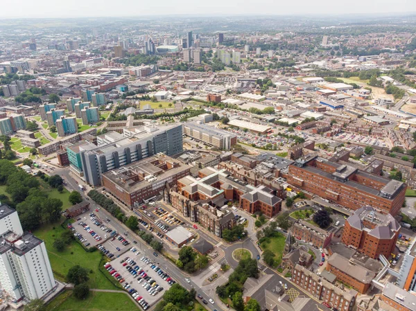 Aerial photo of the St. James\'s University Hospital in Leeds, West Yorkshire, England, showing the Hospital, A&E entrance and grounds and also the Leeds City Centre in the background on a sunny day.