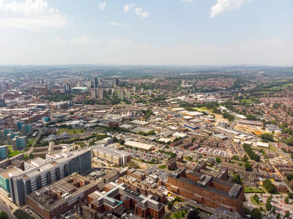 Aerial photo of the St. James\'s University Hospital in Leeds, West Yorkshire, England, showing the Hospital, A&E entrance and grounds and also the Leeds City Centre in the background on a sunny day.