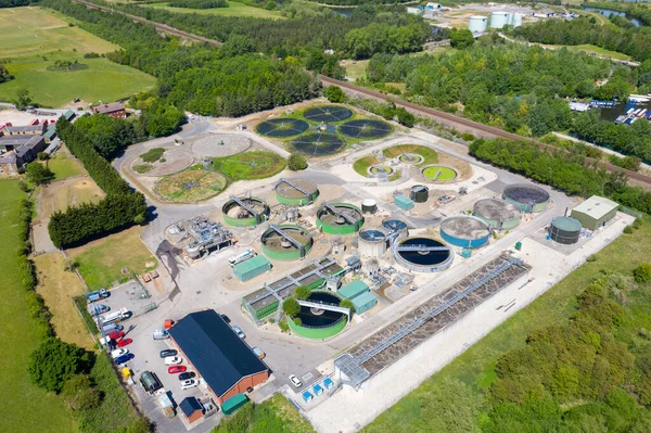 Aerial photo of purification tanks of modern wastewater treatment plant, the waste water and sewage treatment plant is located in the town of Methley Leeds in West Yorkshire UK along side train tracks