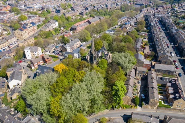 Aerial photo of the village of Morley in Leeds, West Yorkshire in the UK, showing an aerial drone view of the main street and historical old town hall and clock tower