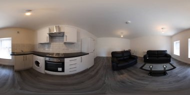 360 derece küresel panorama küresi. Yepyeni bir İngiliz banyosu stüdyo dairesinin fotoğrafı. Koltukları ve mutfak alanını gösteriyor.