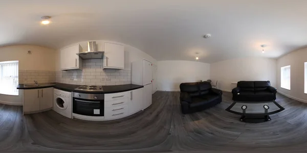360 derece küresel panorama küresi. Yepyeni bir İngiliz banyosu stüdyo dairesinin fotoğrafı. Koltukları ve mutfak alanını gösteriyor.