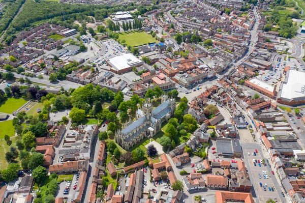 Aerial photo of the historical Selby Abbey in the town of Selby in York North Yorkshire in the UK showing the English medieval church buildings displaying both Norman and Gothic styles in the town