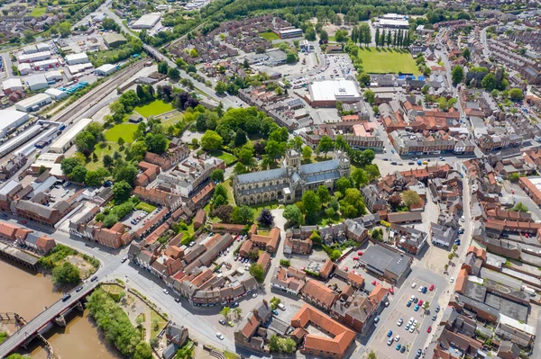 Aerial photo of the historical Selby Abbey in the town of Selby in York North Yorkshire in the UK showing the English medieval church buildings displaying both Norman and Gothic styles in the town