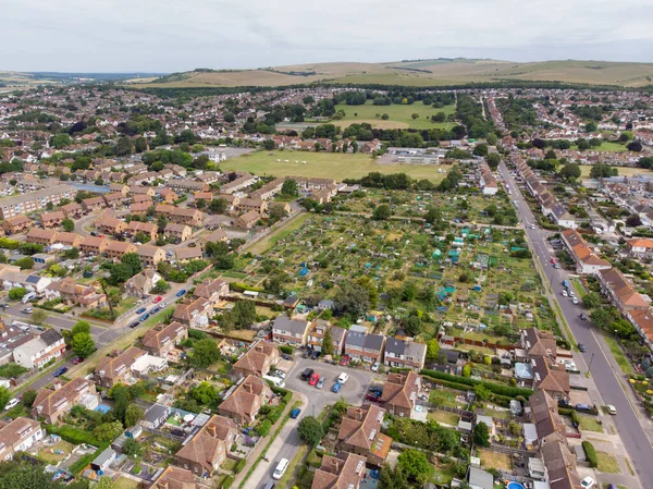 Aerial photo of the town of Shoreham-by-Sea, a seaside town and port in West Sussex, England UK, showing typical housing estates and businesses taken on a bright sunny day.