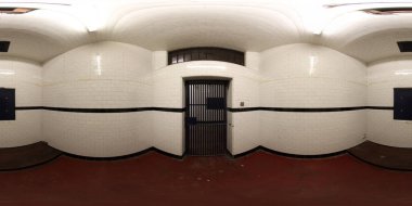360 Degree panoramic sphere photo showing the interior of the historic Leeds Town Hall showing an old prison cell and holding cells clipart