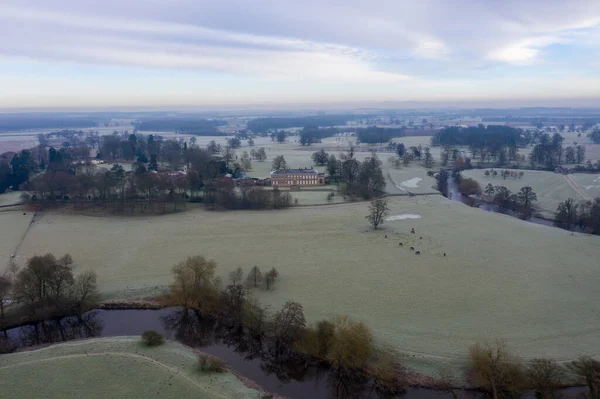 Aerial photo of the British country side taken on a cold winters frosty morning showing an aerial view of the cold British scenic rural area in the UK village of Wetherby in West Yorkshire