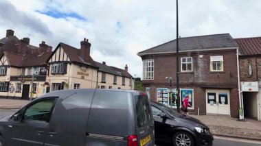 Brompton, Northallerton North Yorkshire UK, 28th July 2025: Slow motion footage of the British village of Brompton showing a classic historical The Durham Ox public house and main street