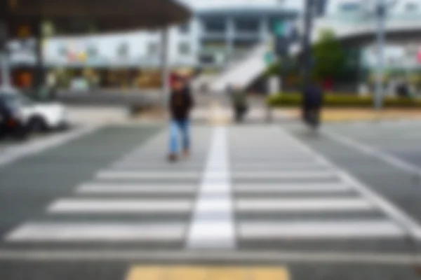 A People crossing utcai crosswalk homályos absztrakt háttér — Stock Fotó