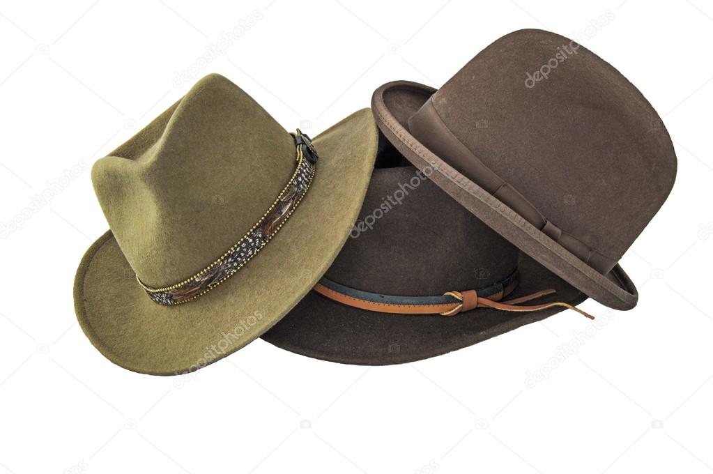 A derby or bowler, and two outback style hats isolated on white