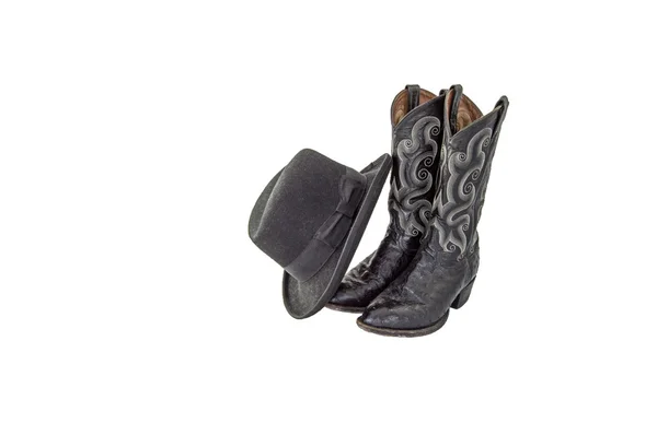 Um par de botas de cowboy preto fantasia com um homburg feltro preto — Fotografia de Stock