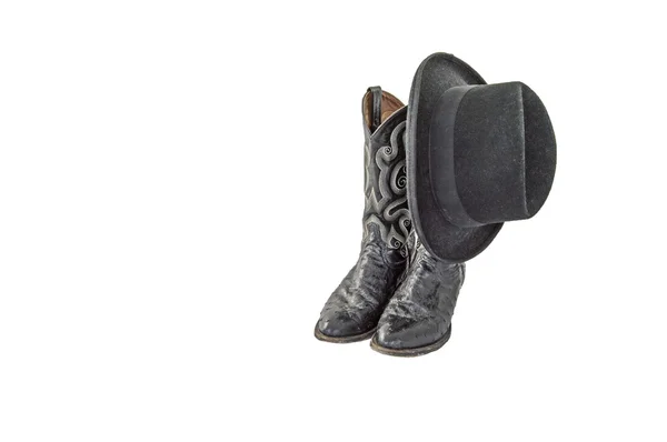 Um par de botas de cowboy preto fantasia com um homburg feltro preto — Fotografia de Stock